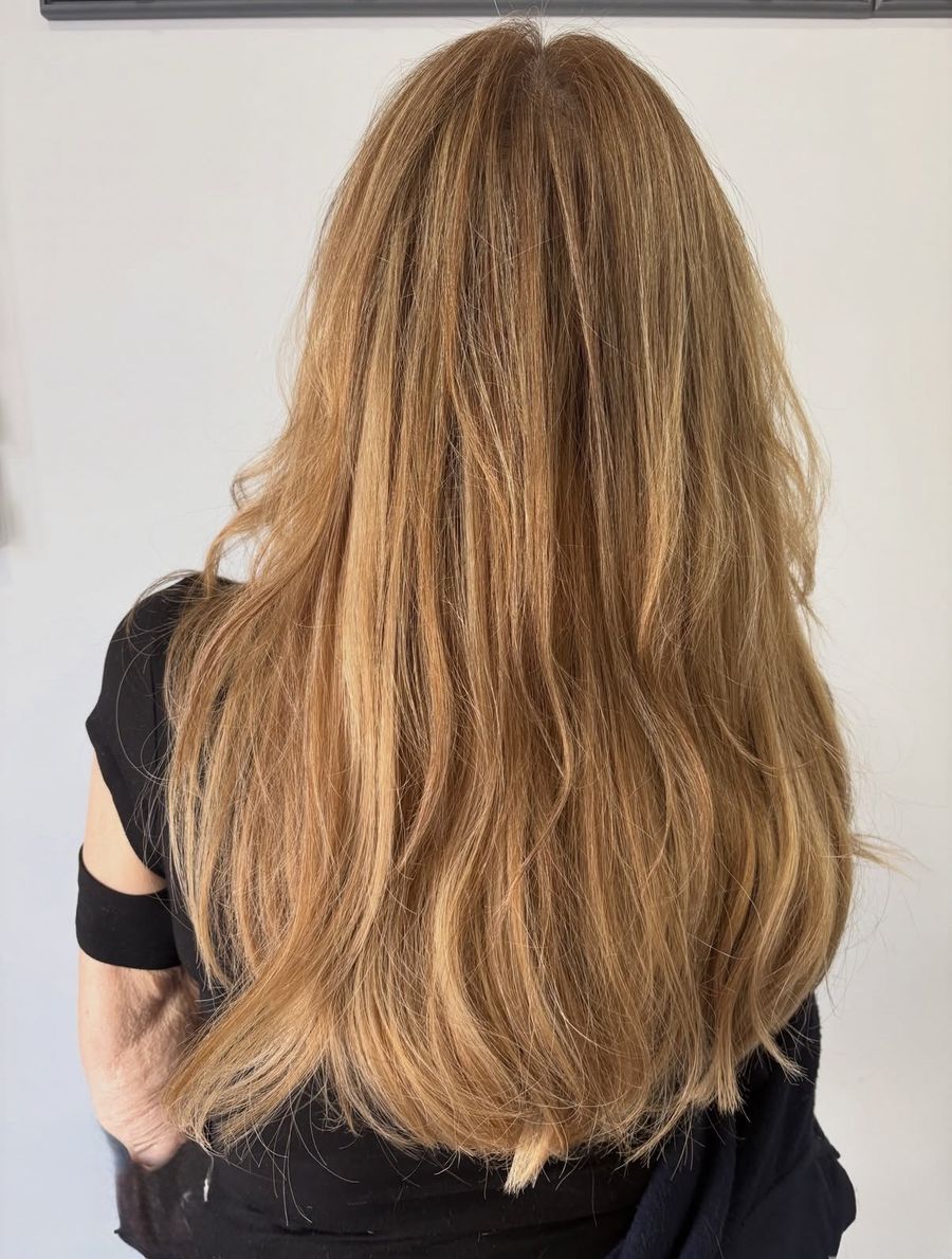 Long golden copper hair with soft layers